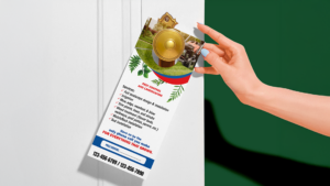 Hand placing a landscaping services door hanger on a front door handle, highlighting seasonal offers.
