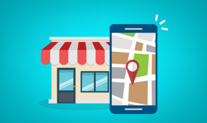 Illustration of a local storefront next to a smartphone with a map and red location pin